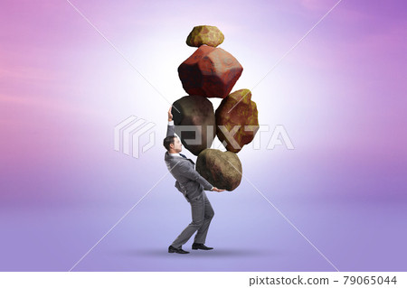 Businessman under burden in business concept Businessman under burden in business concept 79065044
