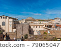 Old roofs under a blue sky in Rome 79065047
