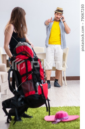 Young active pair preparing for honeymoon trip 79067280