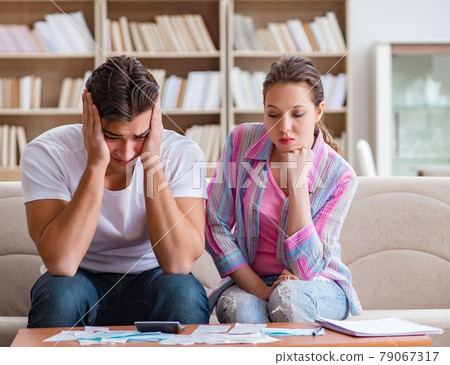Young family discussing family finances Young family discussing family finances 79067317
