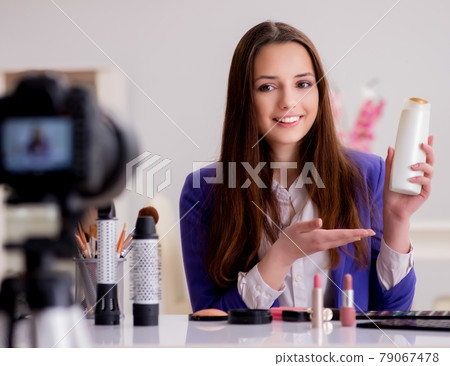 Beauty fashion blogger recording video for blog 79067478