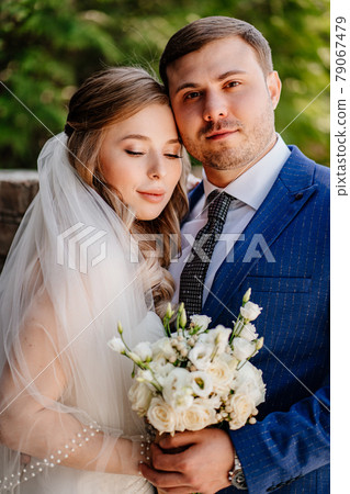 portrait of the bride and groom. beautiful and romantic newlyweds. portrait of the bride and groom. beautiful and romantic newlyweds. 79067479