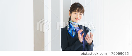 Business woman searching on a smartphone Business woman searching on a smartphone 79069025