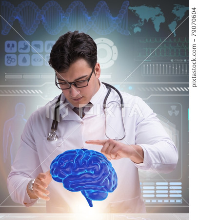 Male doctor with the brain in medical concept 79070604
