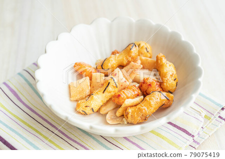 Snacks in a white bowl Snacks in a white bowl 79075419