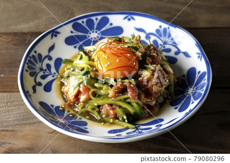 Yukhoe of cucumber and prosciutto with egg yolk, red pepper and sesame seeds 79080296