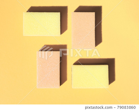 Dishwashing sponges on orange background Dishwashing sponges on orange background 79083860