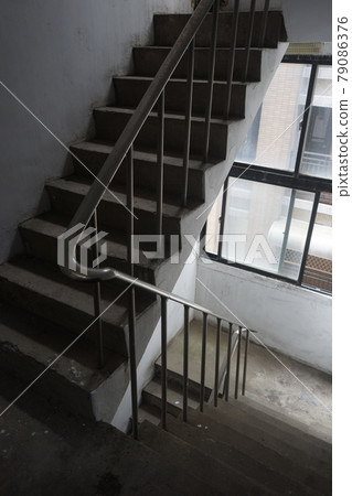 Old staircase stone stairwell apartment building 79086376
