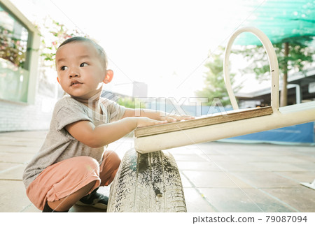 kid asian playing in the outdoor playground kid asian playing in the outdoor playground 79087094