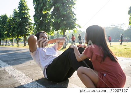Healthy lifestyle of family with child. dad sit up and child sitting on the feet Healthy lifestyle of family with child. dad sit up and child sitting on the feet 79087167
