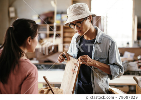 Carpenter Using Butterfly Joints 79087829