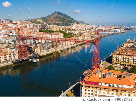 Aerial view of modern Vizcaya bridge crossing river at Portugalete Aerial view of modern Vizcaya bridge crossing river at Portugalete 79088758