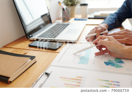 Entrepreneurs Discussing Report on Business Activity Entrepreneurs Discussing Report on Business Activity 79088759