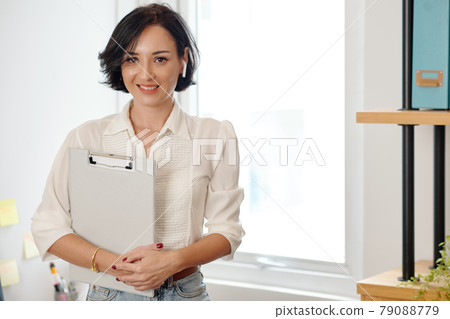 Smiling Businesswoman with Clipboard Smiling Businesswoman with Clipboard 79088779