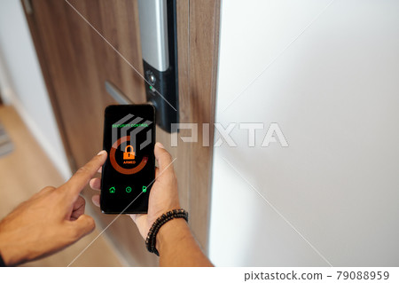 Man Using Smart Lock Applicaition 79088959