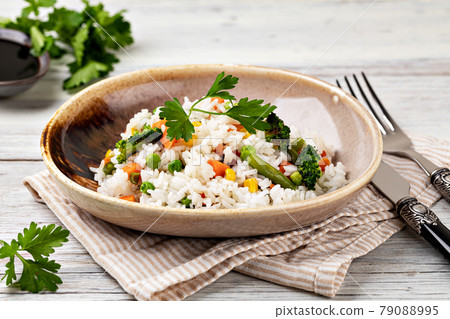 Bowl with tasty rice and vegetables Bowl with tasty rice and vegetables 79088995
