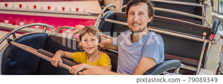 happy smiling son and his handsome father spending fun time together at amusement park BANNER, LONG FORMAT happy smiling son and his handsome father spending fun time together at amusement park BANNER, LONG FORMAT 79089349
