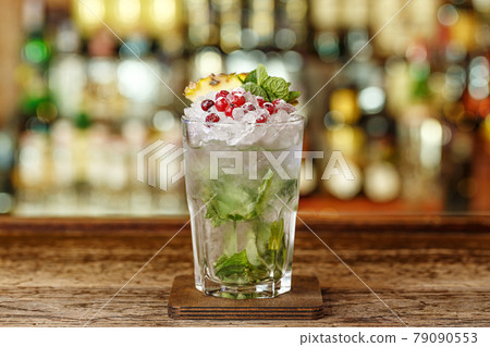 Cocktail with brandy, mint and peach puree 79090553