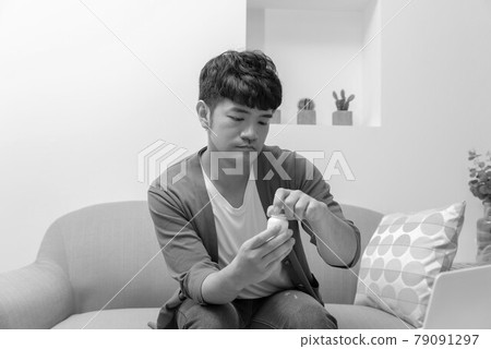 Sick young man in isolation at home Sick young man in isolation at home 79091297