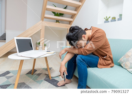 Sick young man in isolation at home Sick young man in isolation at home 79091327