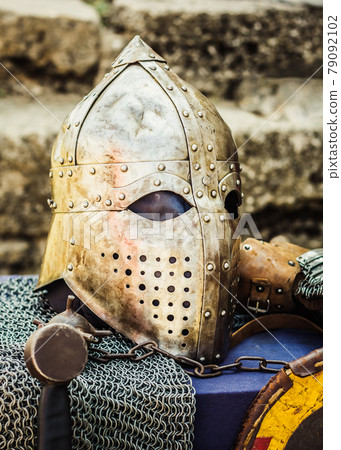 Protective helmet with a visor on medieval knight Protective helmet with a visor on medieval knight 79092102