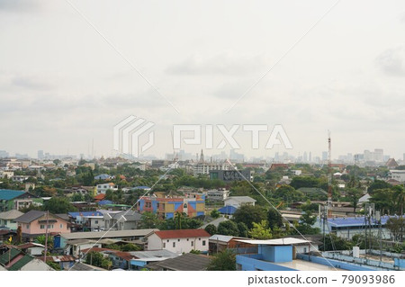 Scenery of Bangkok, Thailand. Wat Arun (also known as the Temple of Dawn) can be seen in the distance. Scenery of Bangkok, Thailand. Wat Arun (also known as the Temple of Dawn) can be seen in the distance. 79093986