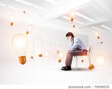 young businessman on chair in office 79094050