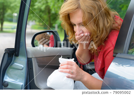 Woman suffering from motion sickness Woman suffering from motion sickness 79095002