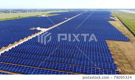Aerial drone view flight over solar power station panels. Aerial drone view flight over solar power station panels. 79095324