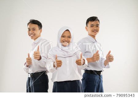 three smiling teenagers wearing junior high school uniforms stand with thumbs up three smiling teenagers wearing junior high school uniforms stand with thumbs up 79095343