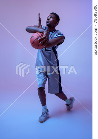 Strong basketball player hand holds ball Strong basketball player hand holds ball 79095906