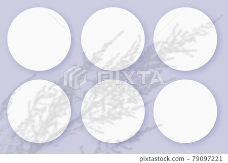 Mockup with vegetable shadows superimposed on 6 round sheets of textured white paper on a violet table background 79097221