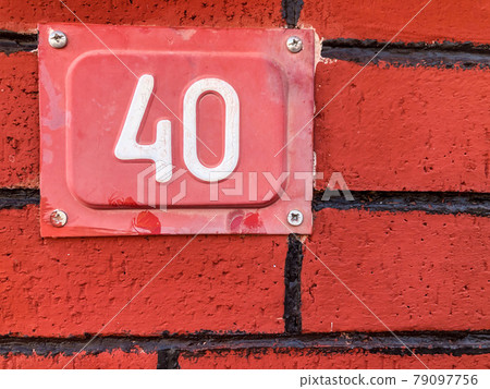number forty on a brick wall 79097756