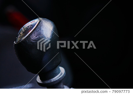 Detailed view of the gear knob of a gear shift in a car, low depth of field Detailed view of the gear knob of a gear shift in a car, low depth of field 79097773