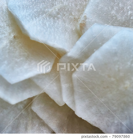 Intentionally dull slices of white radish Intentionally dull slices of white radish 79097860