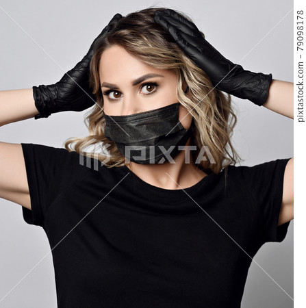Surprised blonde woman in black t-shirt Surprised blonde woman in black t-shirt 79098178