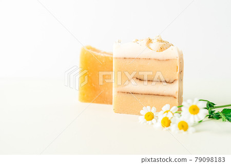 Homemade herbal Soap with chamomile Flowers on white marble background. Zero waste, natural organic bathroom cosmetics. Plastic free life. Ecological skin care, body treatment concept. Homemade herbal Soap with chamomile Flowers on white marble background. Zero waste, natural organic bathroom cosmetics. Plastic free life. Ecological skin care, body treatment concept. 79098183