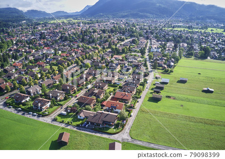 Aerial view of a holiday home settlement at the edge of a Bavarian small town 79098399