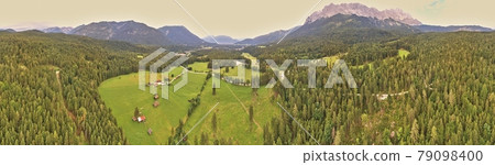 Panorama of a forest and a valley with meadows and pastures in front of the mountains of the Alps, composed of several aerial photos, high resolution Panorama of a forest and a valley with meadows and pastures in front of the mountains of the Alps, composed of several aerial photos, high resolution 79098400