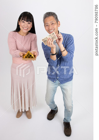 Middle-aged couple happy to get a lot of money Middle-aged couple happy to get a lot of money 79098786