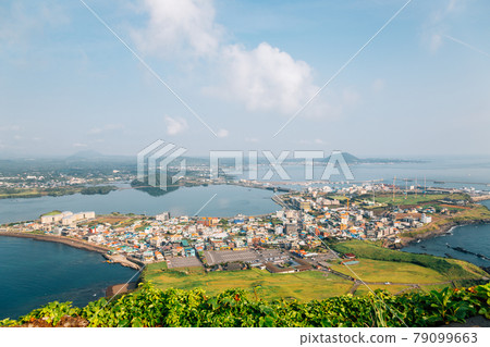 Panoramic view of seaside village from Seongsan Ilchulbong Tuff Cone in Jeju Island, Korea Panoramic view of seaside village from Seongsan Ilchulbong Tuff Cone in Jeju Island, Korea 79099663