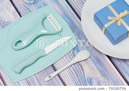 Top view of cutlery set on the wooden background. Top view of cutlery set on the wooden background. 79100756