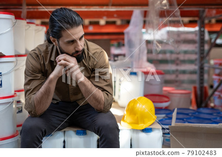 Young tired male worker having rest Young tired male worker having rest 79102483