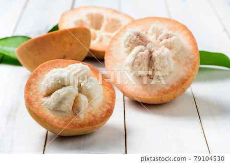Half Santol on wood background, famous fruit of Lopburi Province. THAILAND 79104530