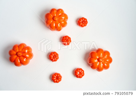 Halloween background, orange decorative plastic pumpkin white cardboard Thanksgiving greeting card Halloween background, orange decorative plastic pumpkin white cardboard Thanksgiving greeting card 79105079