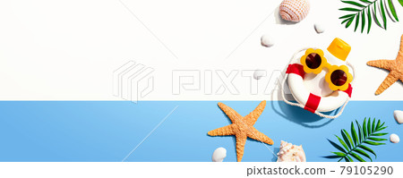 Sunblock bottle wearing sunglasses with starfish and seashells 79105290