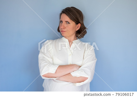 Caucasian woman with mistrust frown confused facial emotion. Caucasian woman with mistrust frown confused facial emotion. 79106017