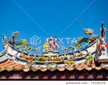 Asia culture concept - Roof with beautiful decoration of famous heritage landmark, the traditional old oriental Chinese temple in Taiwan. Asia culture concept - Roof with beautiful decoration of famous heritage landmark, the traditional old oriental Chinese temple in Taiwan. 79106376