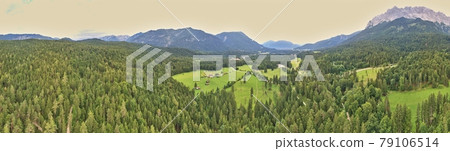 Panorama of a forest and a valley with meadows and pastures in front of the mountains of the Alps, composed of several aerial photos, high resolution Panorama of a forest and a valley with meadows and pastures in front of the mountains of the Alps, composed of several aerial photos, high resolution 79106514
