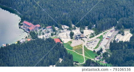 View from the mountain station to the valley station of the cable car to the Zugspitze, with a part of the Eibsee lake. 79106536
